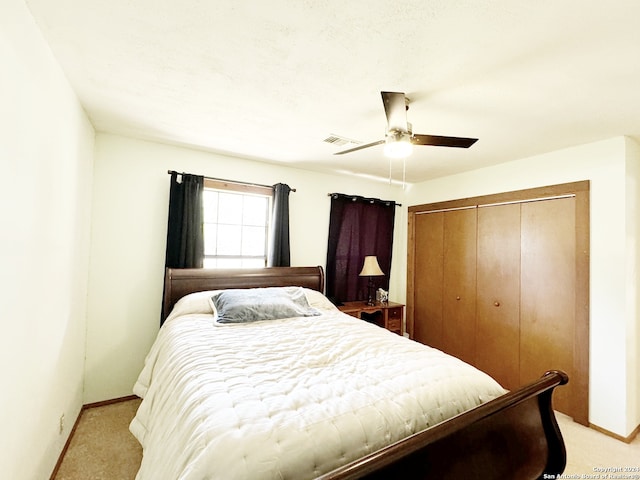 bedroom featuring a closet, ceiling fan, and carpet floors