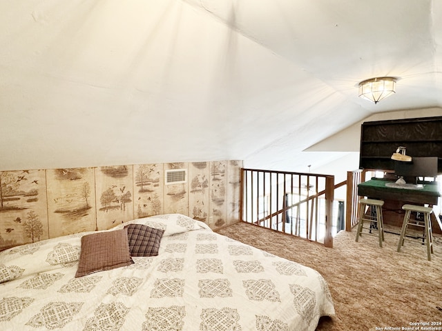 bedroom with carpet floors and vaulted ceiling