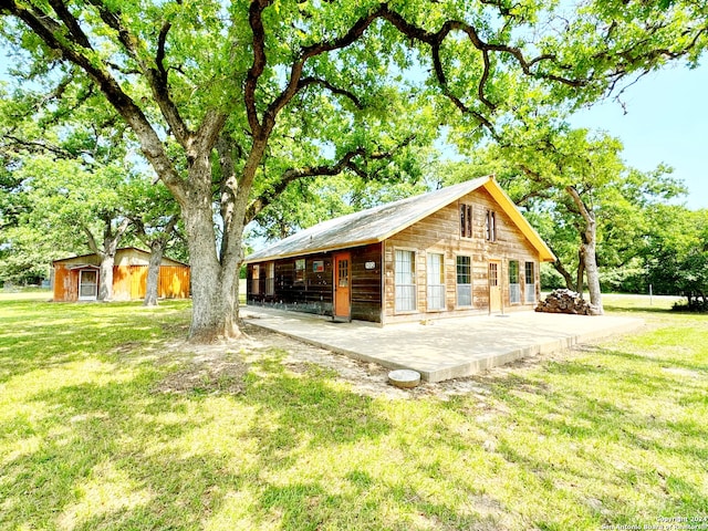 exterior space featuring a patio area and a yard