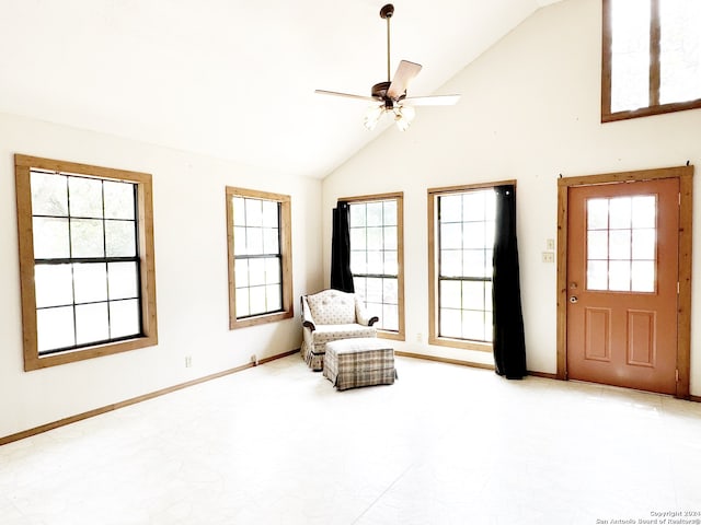 unfurnished room with high vaulted ceiling, ceiling fan, and light tile floors