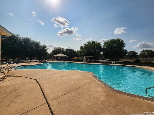 view of pool featuring a patio