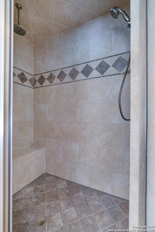 bathroom with tiled shower