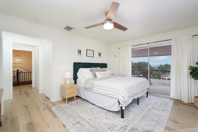 bedroom featuring a closet, ceiling fan, light wood-type flooring, and access to exterior