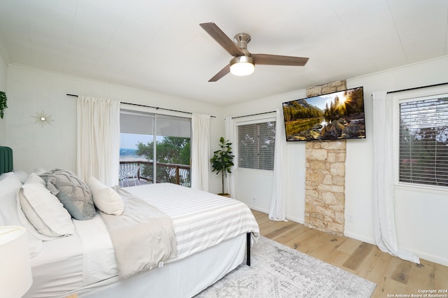 bedroom with ceiling fan, crown molding, light wood-type flooring, and access to exterior