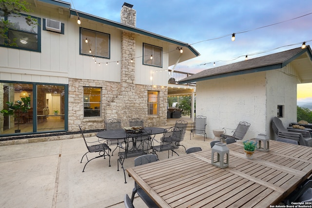 view of patio terrace at dusk