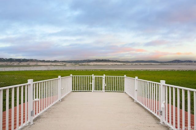 exterior space with a water and mountain view