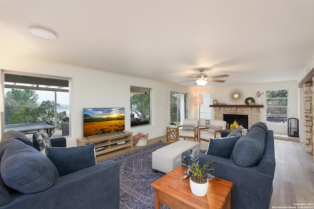 living room with a healthy amount of sunlight, ceiling fan, and hardwood / wood-style floors