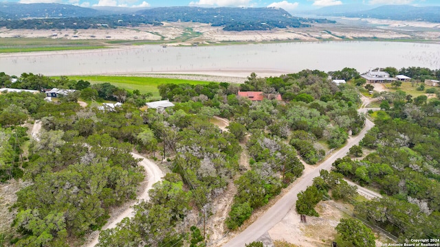 bird's eye view with a water and mountain view