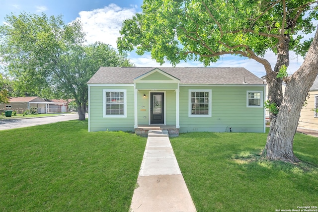 bungalow with a front yard