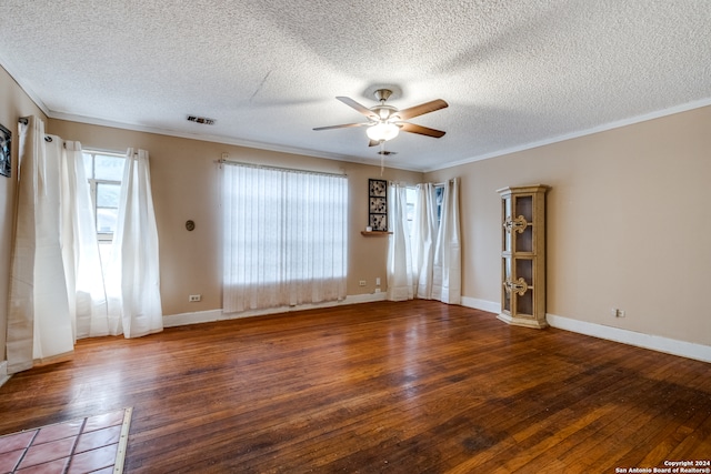 spare room featuring a textured ceiling, hardwood / wood-style floors, ceiling fan, and crown molding