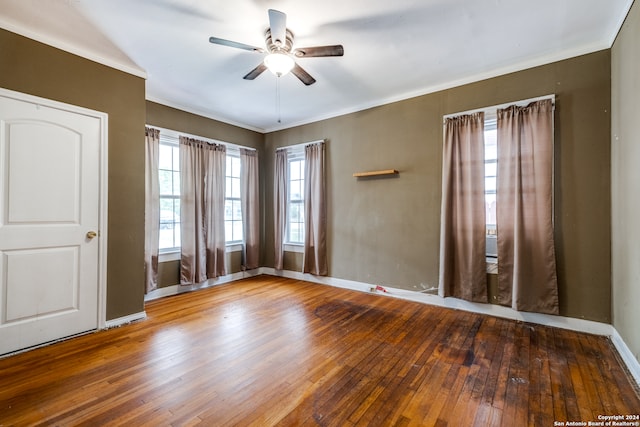 empty room with wood-type flooring and ceiling fan