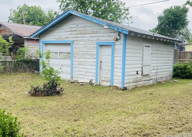 garage with a lawn