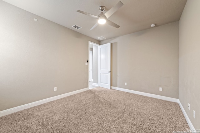 unfurnished room with carpet flooring and ceiling fan