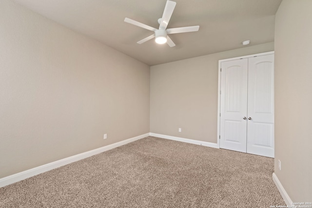 carpeted empty room with ceiling fan