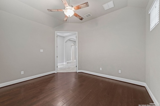 empty room with vaulted ceiling, ceiling fan, and hardwood / wood-style floors