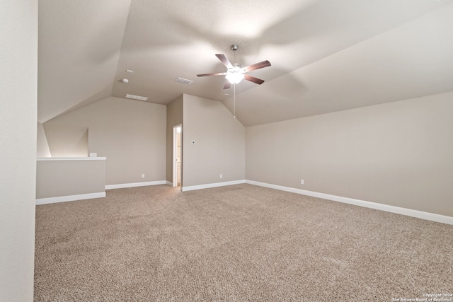 additional living space featuring lofted ceiling, ceiling fan, and carpet