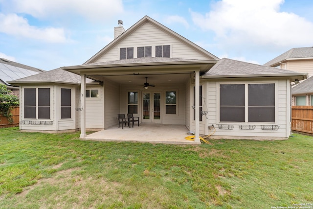 rear view of house featuring a yard, ceiling fan, and a patio area