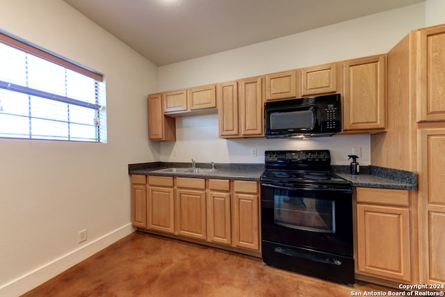 kitchen featuring light brown cabinetry, sink, carpet, and black appliances