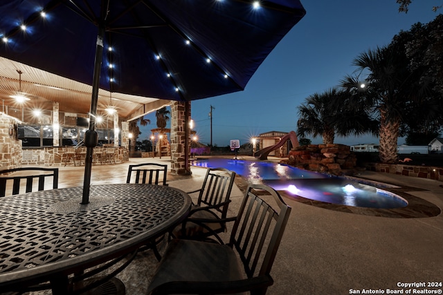 view of patio terrace at twilight