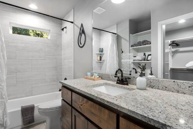 full bathroom featuring vanity, tile patterned floors, toilet, and shower / bath combination with curtain