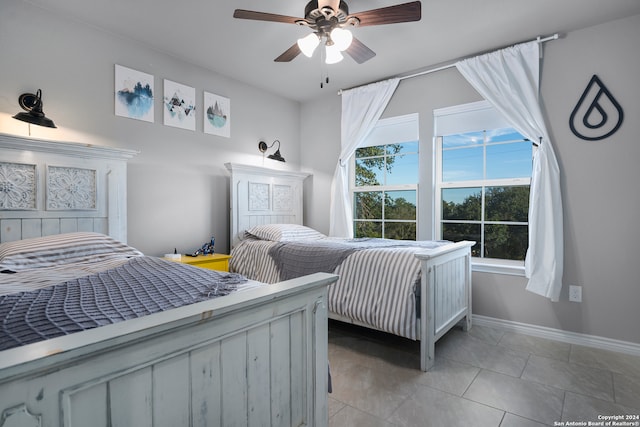 bedroom with light tile patterned floors and ceiling fan