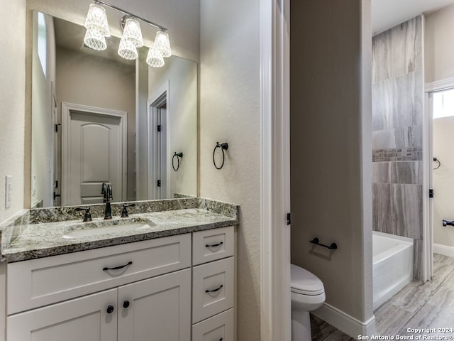 bathroom featuring hardwood / wood-style flooring, vanity, and toilet