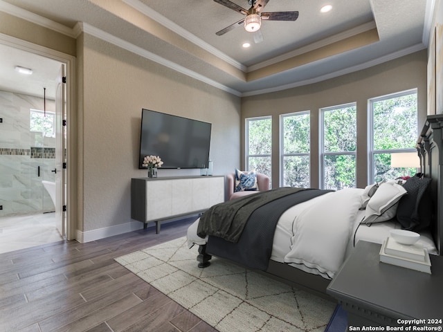 bedroom featuring ornamental molding, ceiling fan, and multiple windows