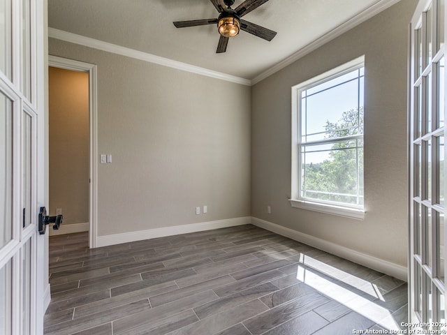 spare room featuring crown molding, dark hardwood / wood-style flooring, and ceiling fan