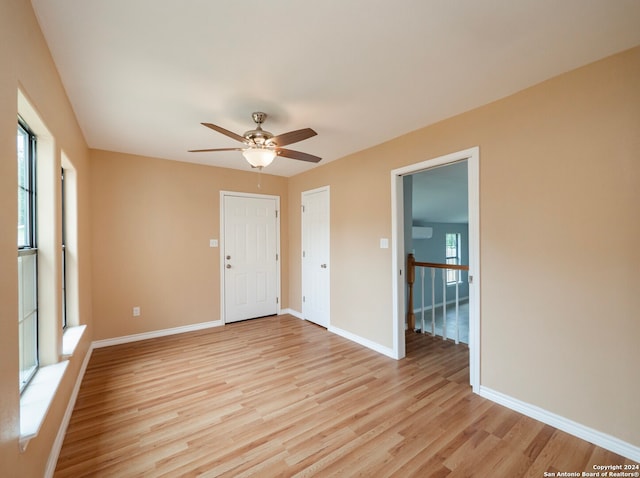 unfurnished room featuring light hardwood / wood-style flooring and ceiling fan