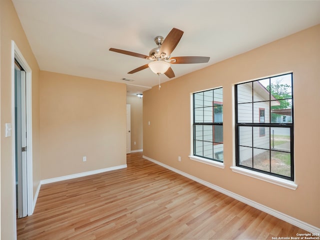 unfurnished room featuring light hardwood / wood-style floors and ceiling fan