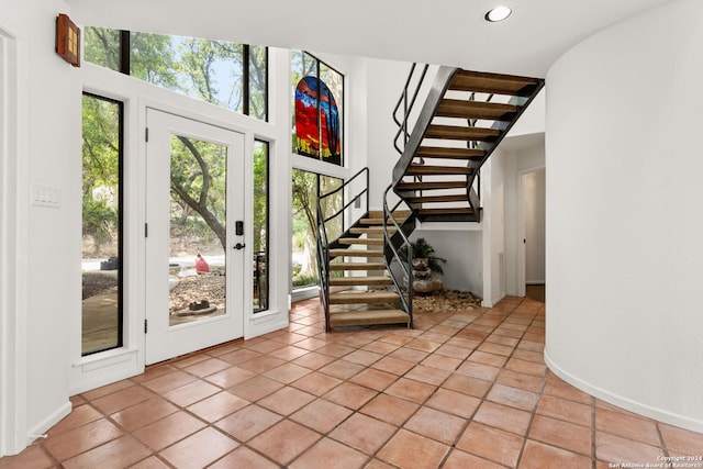 entryway with light tile patterned floors