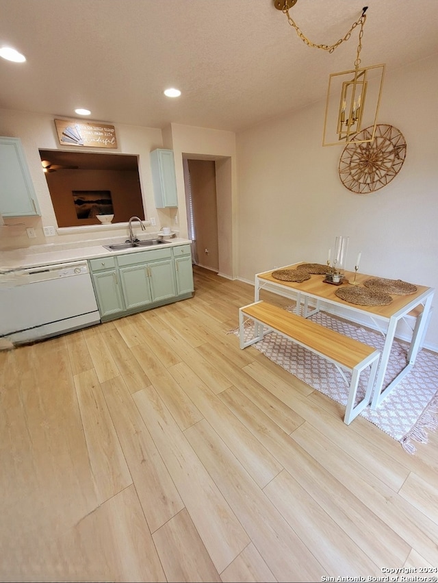 interior space featuring white cabinets, sink, light wood-type flooring, white dishwasher, and green cabinets