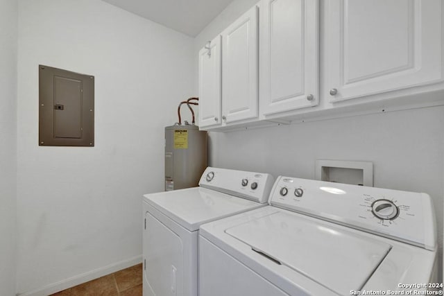 washroom with hookup for a washing machine, cabinets, tile flooring, washer and clothes dryer, and electric water heater