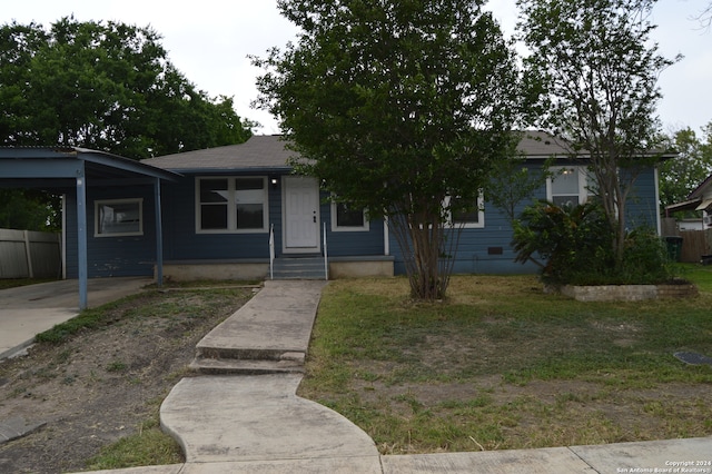 view of front of home featuring a carport