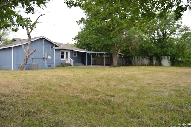 view of yard featuring central air condition unit