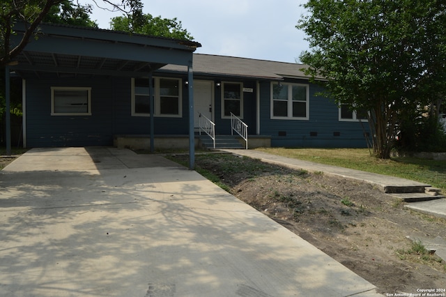 view of front of home with a carport