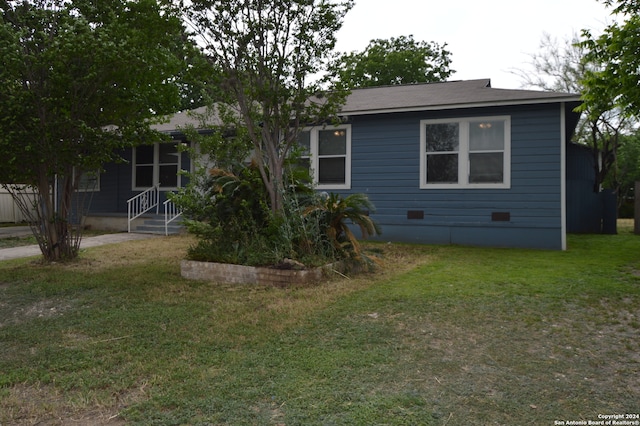 view of front of property with a front lawn