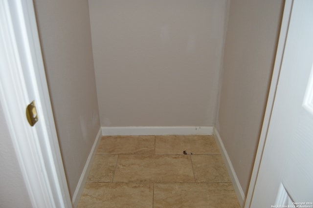 hallway with light tile floors