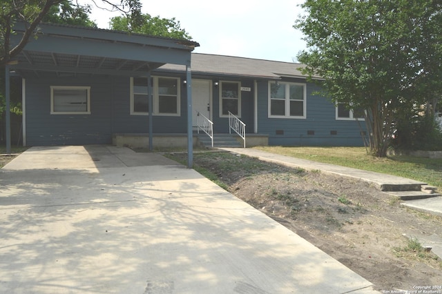 ranch-style house with a carport