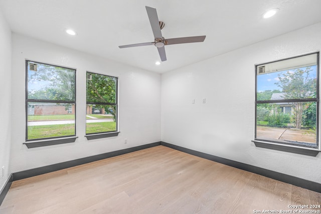 unfurnished room with wood-type flooring and ceiling fan