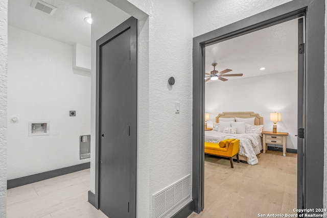 bedroom featuring light hardwood / wood-style flooring and ceiling fan