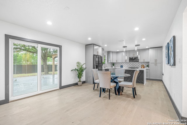 dining area featuring light wood-type flooring