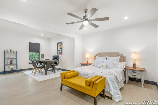 bedroom with ceiling fan and light wood-type flooring