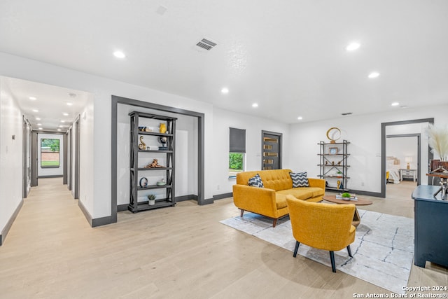 living room with plenty of natural light and light wood-type flooring