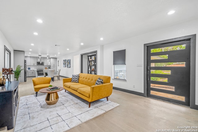 living room with light hardwood / wood-style flooring