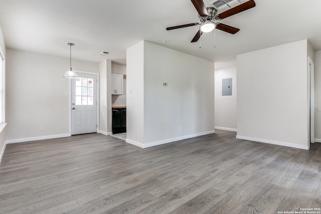 unfurnished living room with light hardwood / wood-style flooring and ceiling fan