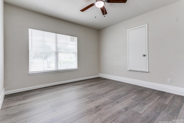 spare room with ceiling fan and hardwood / wood-style floors