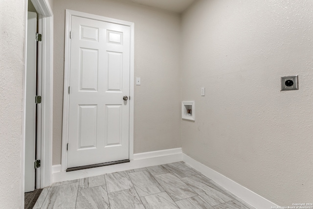 laundry area with hookup for an electric dryer, hookup for a washing machine, and light tile floors