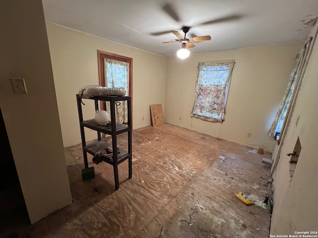 interior space featuring ceiling fan