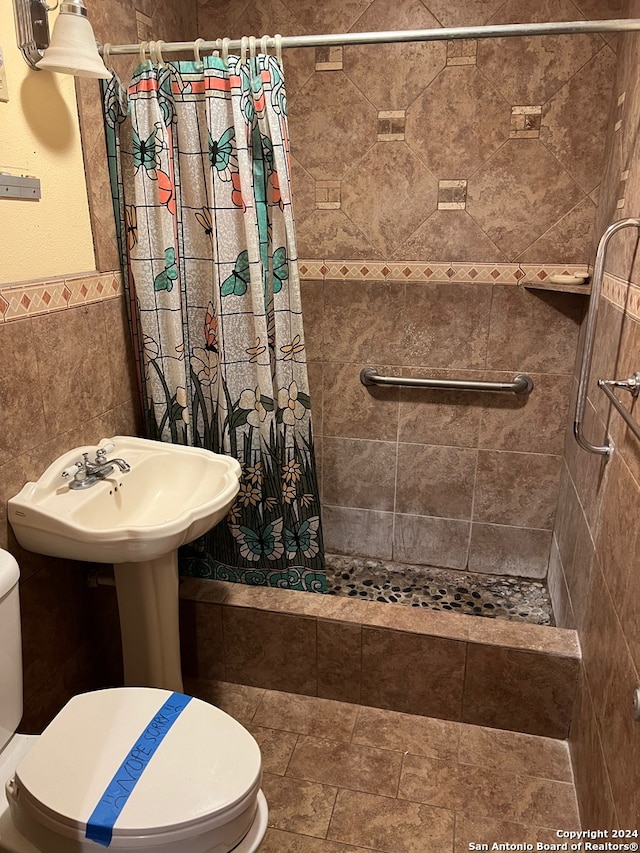 bathroom featuring walk in shower and toilet